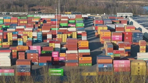 Densely packed container yard towering multicolored stacks branded by global Stock Footage 329079537