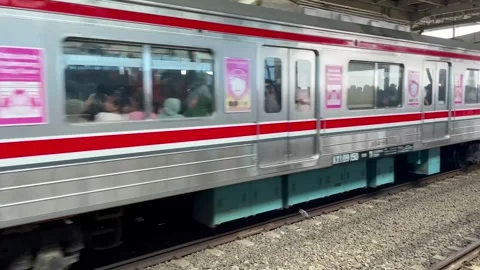 The density of commuter train passengers getting on and off at Manggarai Station Stock Footage 288836933
