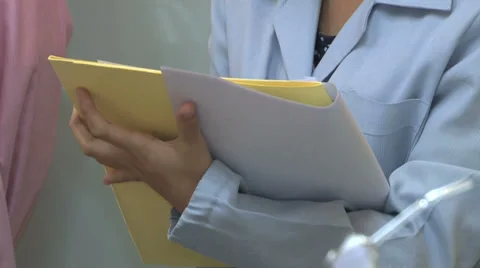 Dental Assistant Checking Her Charts 스톡 동영상 32376672