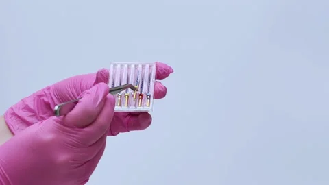 Dental Assistant Organizing Root Canal Instruments in Sterilization Box Stock Footage 333550248