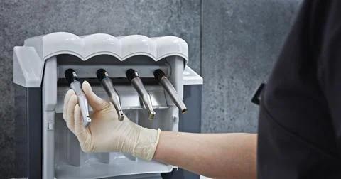 Dental Assistant Preparing Instruments for Sterilization Stock Photos