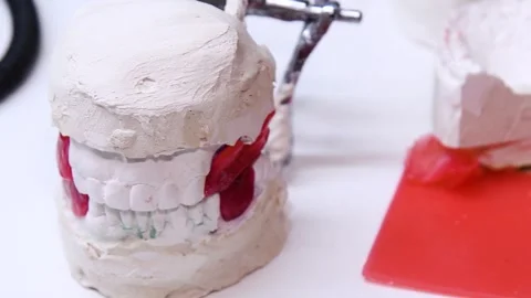 Dental casts placed on the table. The casts are made of plaster and represe.. Stock Footage 340064093