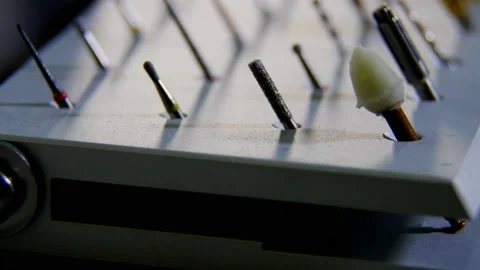 Dental drill burs stuck into special stand on dentist table Stock Footage 239433708