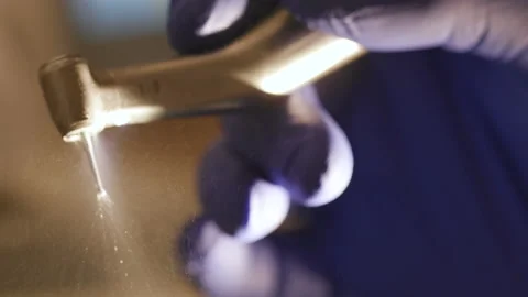 Dental drill, drilling machine, professional tools in the hands of a dentist Stock Footage 194461797