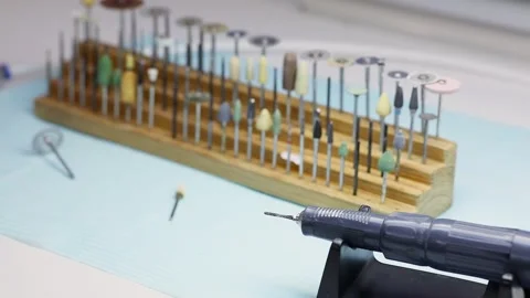 Dental drilling engine and many heads are on table Stock Footage 276374229