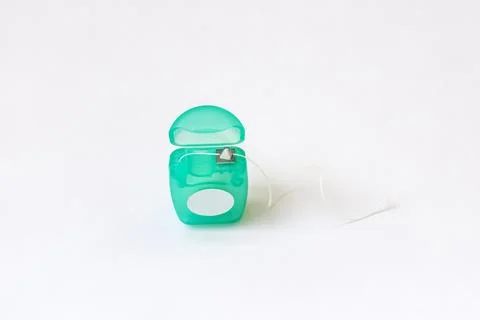 Dental floss container on white background. Stock Photos
