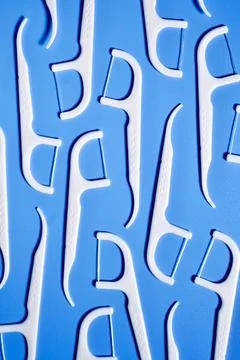 Dental floss pick pattern on blue background 스톡 일러스트