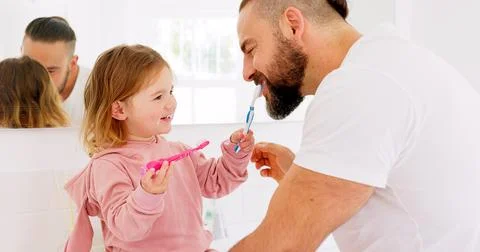 Dental health, father and girl for brushing teeth, together or laugh in bathroom Stock Photos