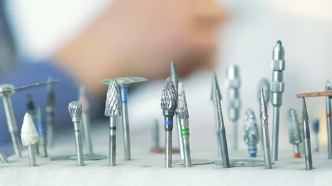 Dental instruments on background of dentist making model of jaw Stock Footage
