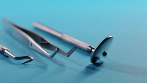 Dental instruments on a blue background. Directions from the slider. Incorrect Stock-Footage 258565224