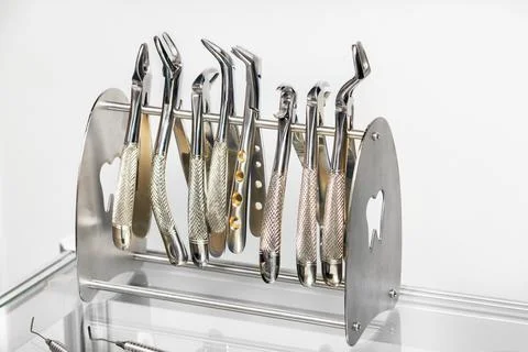 Dental instruments, a set of various forceps for removing teeth. Stock Photos