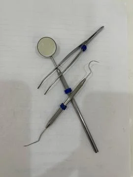 Dental instruments on white background Stock Photos