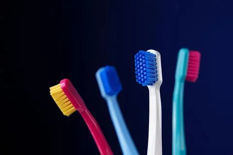Dental king concept. Place for text. Modern photo. Colorful toothbrushes on a Stock Photos