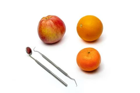 Dental Mirror and Pig Tail Explorer Probe Pick Oral Health Tools with Fruit Stock Photos