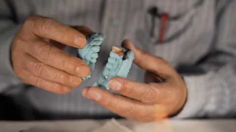Dental occlusion space of a denture cast mold testing, close up shot Stock Footage 108272709
