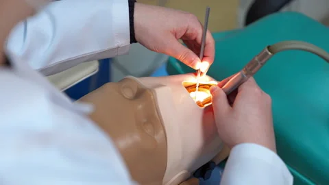 Dental practical exercising with dummy. Professional dental equipment and dental Vidéo 149825588