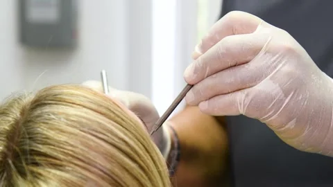 A dental procedure for treating or examining a patient in a dental clinic o.. Vídeos de archivo 328227149