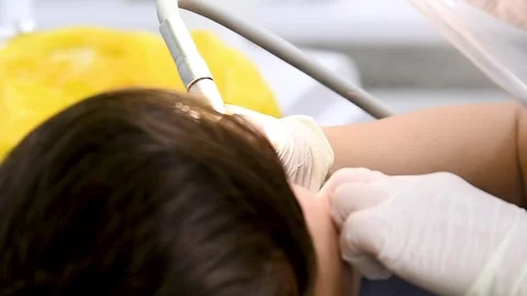 A dental procedure for treating or examining a patient in a dental clinic o.. Video stock 339912337