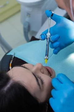 Dental Procedure Visual: Patient Undergoing Anesthesia with a Syringe in a Stock Photos