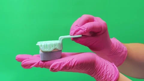 Dental Professional Demonstrating Tooth Brushing and Giving Thumbs Up Stock Footage 337106688