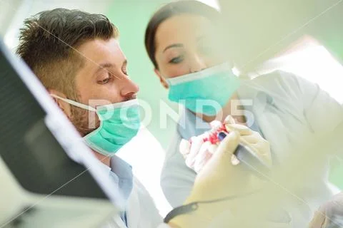 Dental prosthesis, dentures, prosthetics work. Prosthetics hands while working Stock Photos