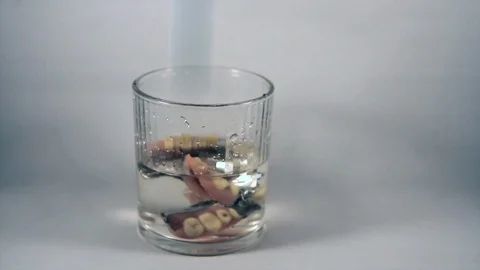 Dental prosthesis that is washed in special tray with the cleaning tablet Stock Footage 116301379