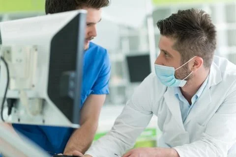 Dental students while working on the denture, false teeth. Stock Photos