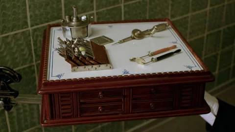 Dental supplies on the dentist's pull-out table. Old vintage dentistry office. Stock Footage 221844509
