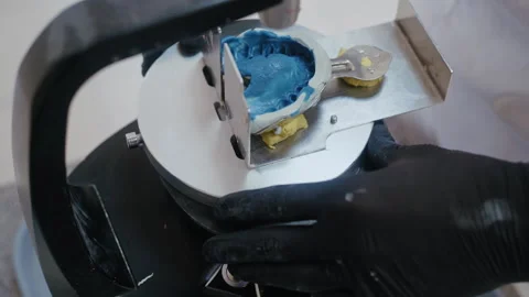 Dental technician creating artificial jaw model 動画素材 336627689