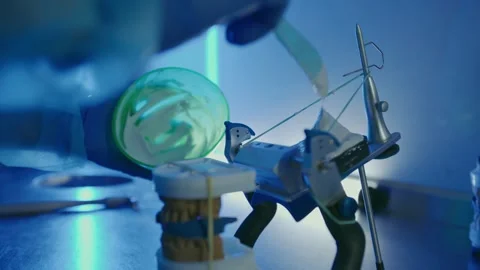A dental technician makes teeth Stock Footage 292510615