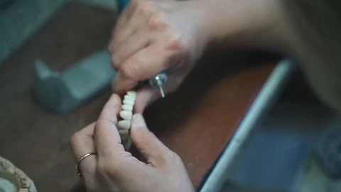 A dental technician makes a tooth. Stock Footage 116749081