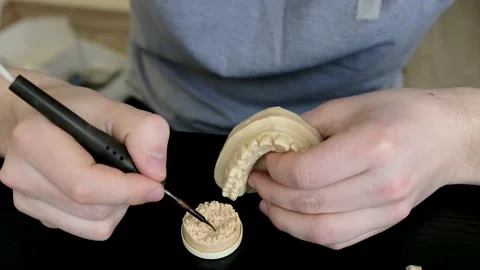 Dental technician modelling tooth crowns with hot wax. Stock Footage 146517521
