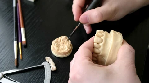 Dental technician modelling tooth crowns with hot wax. Stock Footage 146517525