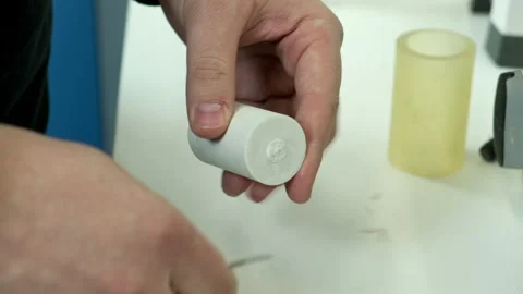 The dental technician opens the flask with a blade. Stock Footage 183953135
