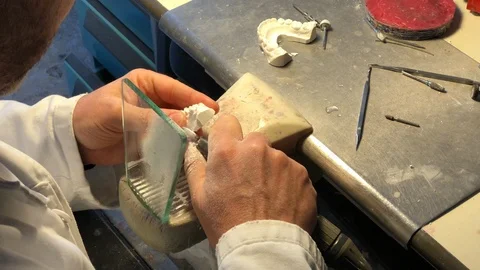 Dental technician working on brackets Stock Footage 122096314