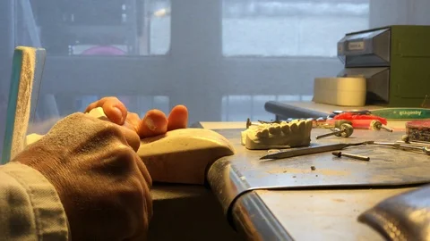 Dental technician working on brackets Stock Footage 122096612