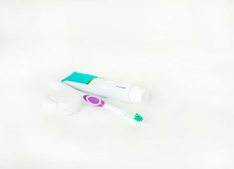 Dental thread, toothbrush and toothpaste isolate white. Stock Photos