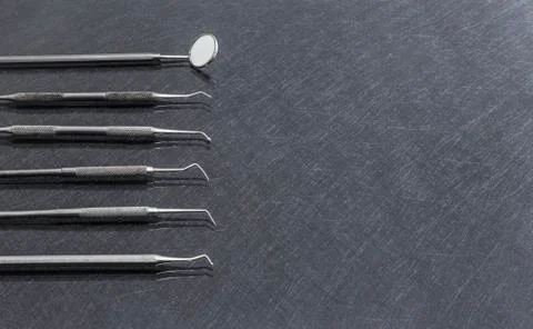 Dental tools on gray background top view Stock Photos