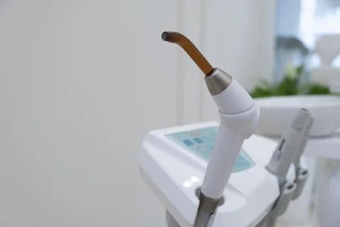 Dental UV curing lamp for polymerization of dental materials Stock Photos
