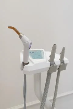 Dental UV curing lamp for polymerization of dental materials Stock Photos