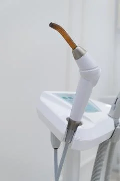 Dental UV curing lamp for polymerization of dental materials Stock Photos