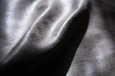 Dented fabric with texture highlighted by light Stock Photos