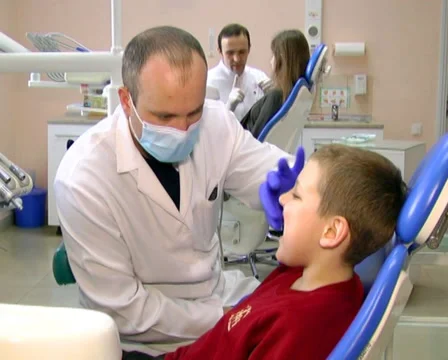 Dentist advises child 2 Stock Footage 35015836