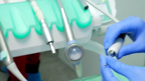Dentist And Assistant Checking Dental Hygiene Of Female Client Video stock 72346389