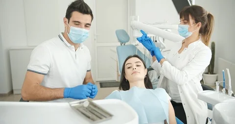 Dentist and Assistant Working 動画素材 119329732