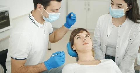 Dentist and Assistant Working 動画素材 119332981