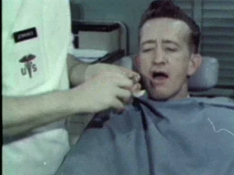 A dentist applies a plaster mold to tests for a partial denture cast to a Stock Footage 75266591