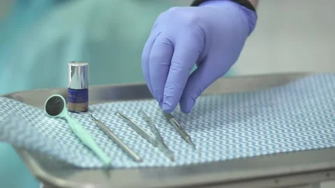Dentist is arranging tools before working with a patient 動画素材 130854642