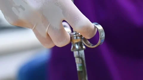 Dentist assistant preparing an injection with anesthesia before surgery Stock Footage 218347415