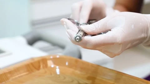 Dentist assistant preparing an injection with anesthesia before surgery Stock Footage 218347419
